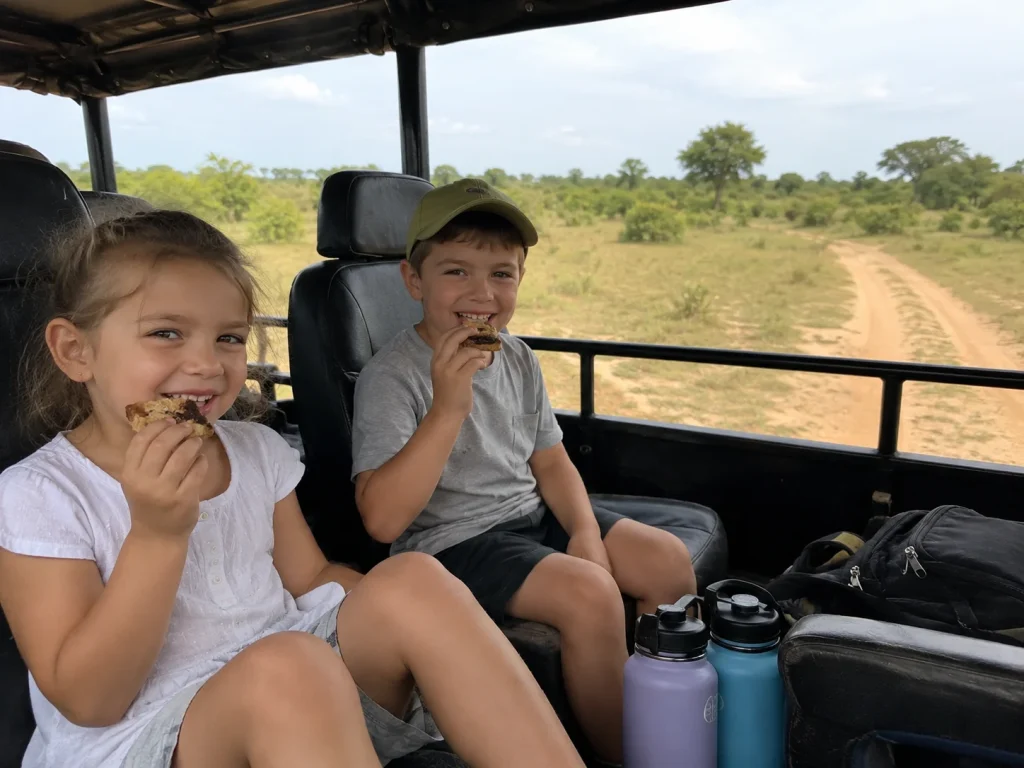 Children eating happily while enjoying a safari ride